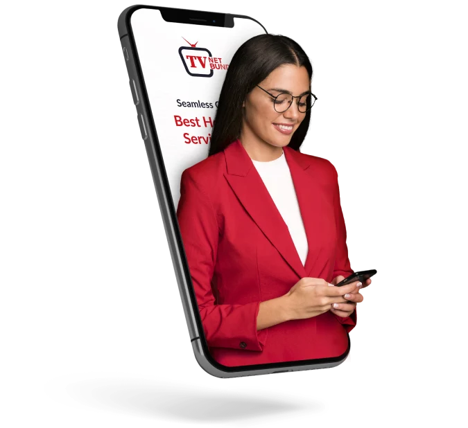 Woman in red suit checking phone.