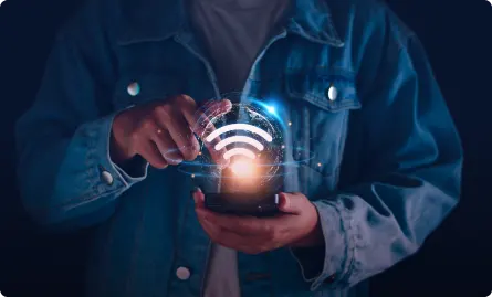 A person holding a phone with a wifi symbol.